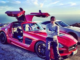 Lewis Hamilton Poses With His Red SLS AMG Black and SL 65 AMG Black