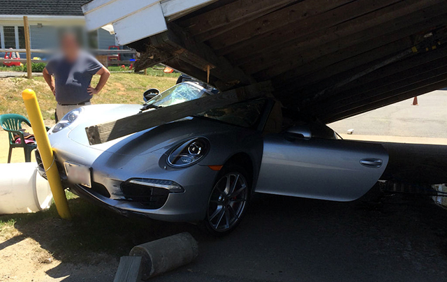 Porsche 911 crashes into car wash front