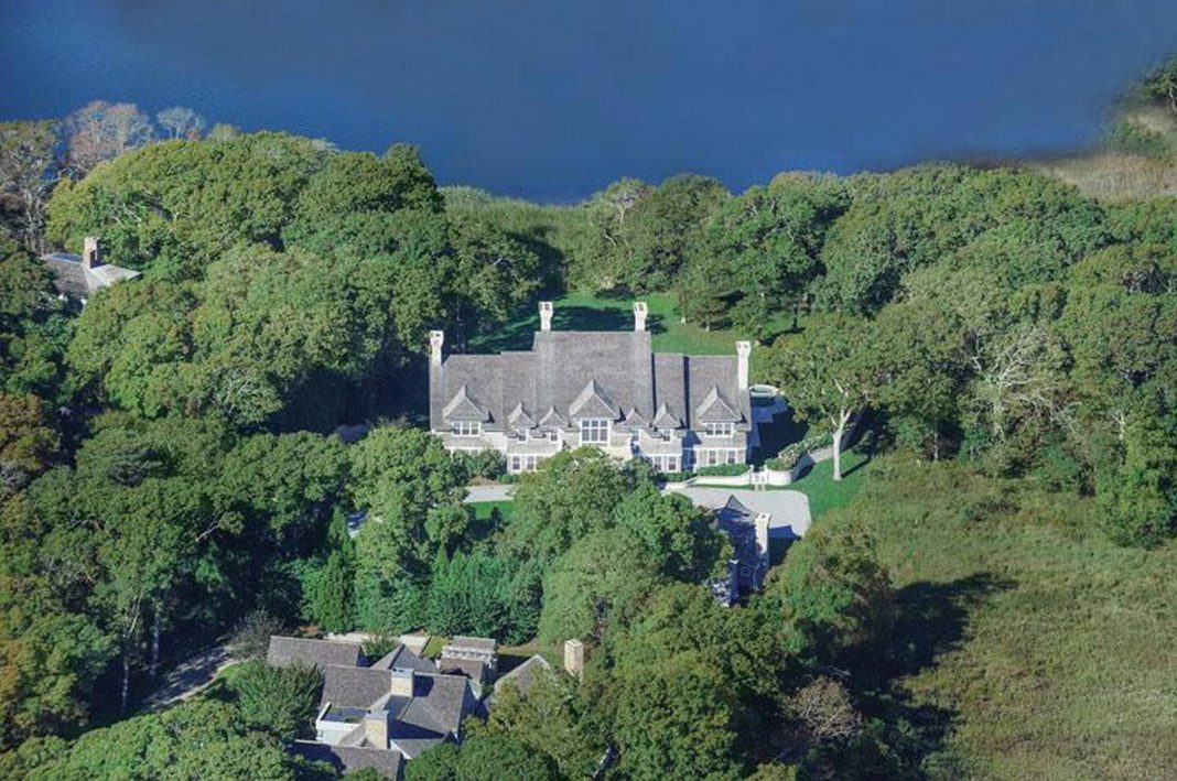 Aerial view mansion with pond front